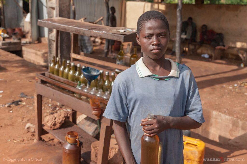 Buying Fuel From Glass Bottles at a Gas Station in Mali