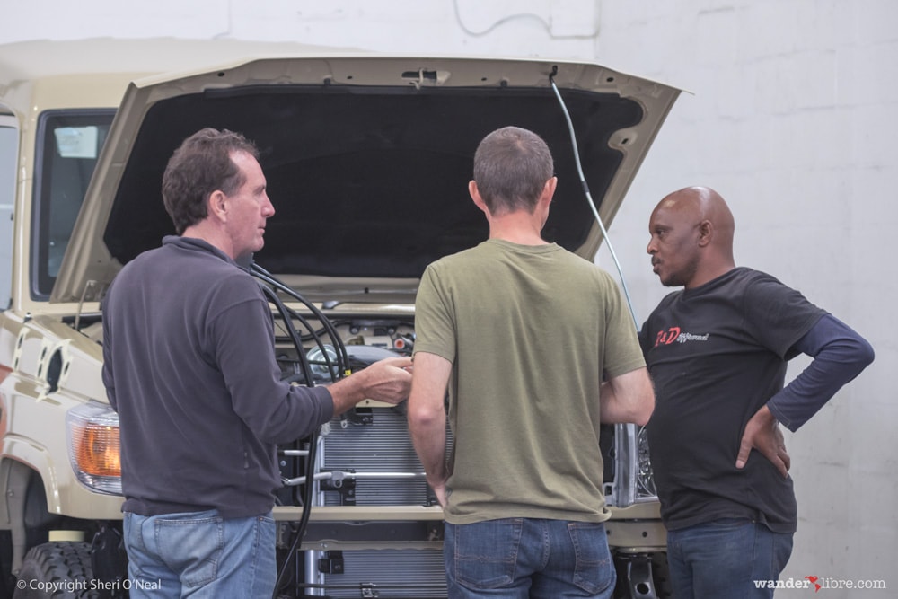 Jim Discusses Air Compressor Placement with the Team