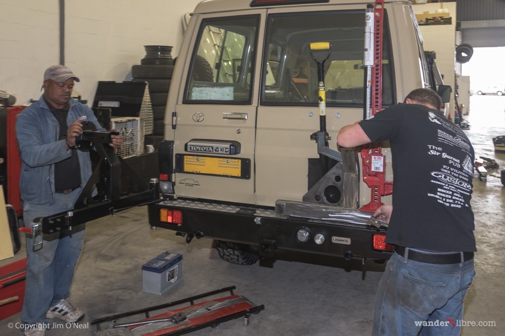 R&D Offroad customizing dual wheel carrier to hold shovel and hi-lift jack