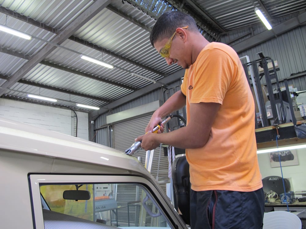 Alu-Cab installing pop-top tent on a Land Cruiser Troopy