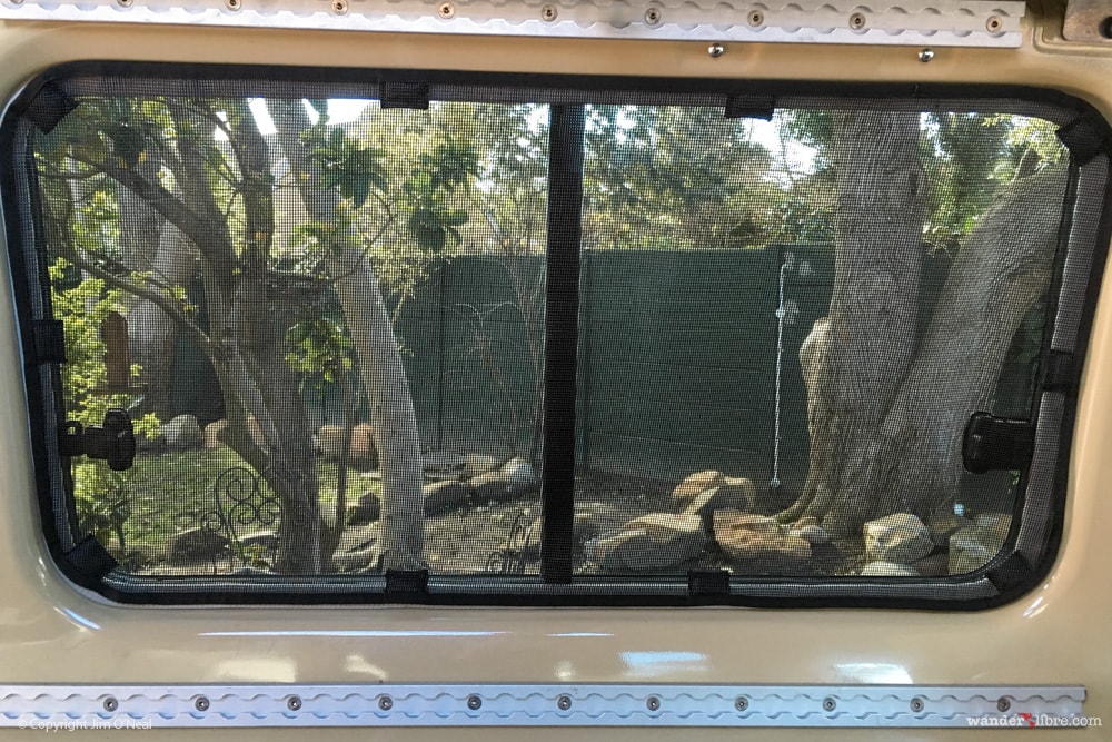 Custom Magnetic Bug Screens Over Rear Windows of Troop Carrier