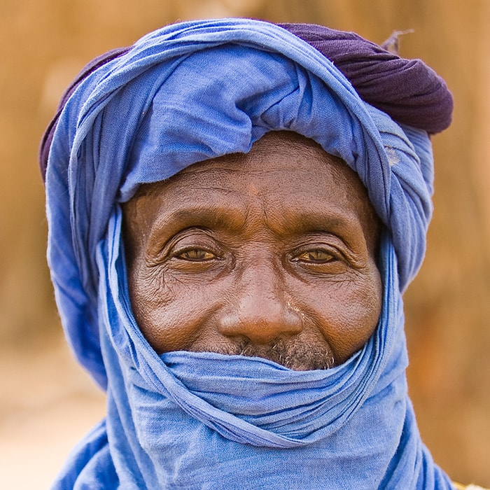 A toureg dressed in blue at the market in Groom Groom Burkina Faso
