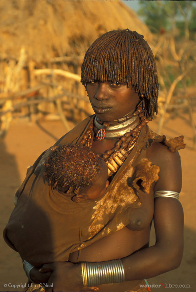 Hamar woman holding her child in Ethiopia's Omo Valley