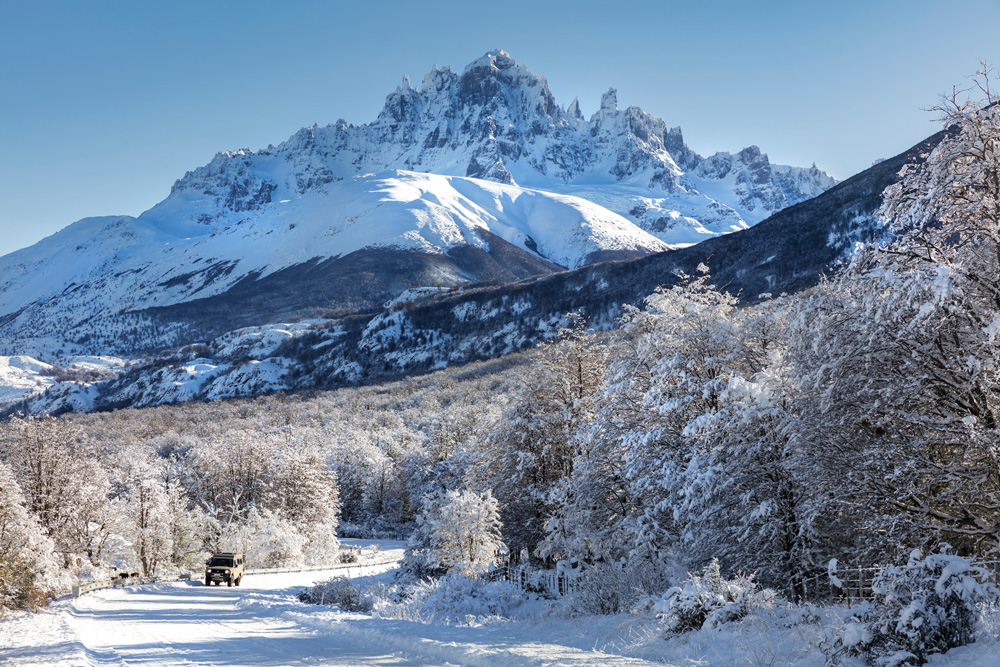 Driving north up the Carretera Austral in Patagonia, Chile with Cerro Castillo in the background