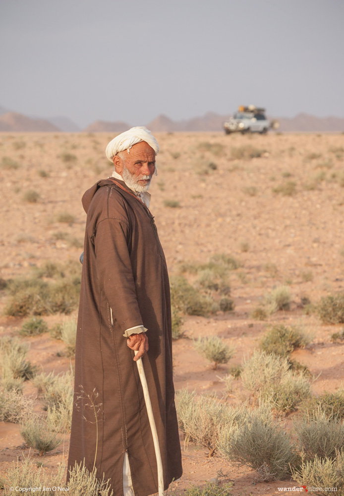 A portrait of a camel herder taken in Boudnib, Morocco during our first trans-Africa overland trip. In the background, Betty, our 80 Series Land Cruiser.