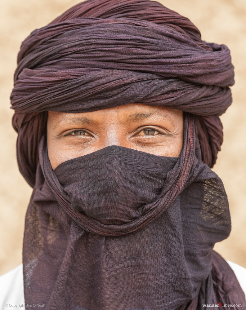 A portrait of a muslim man taken in front of Sidi Yahya mosque in Timbuktu, Mali.