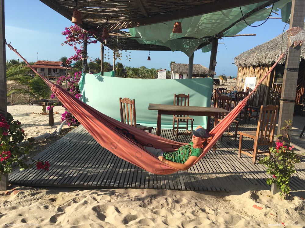 Sheri relaxes in a hammock between after kiteboarding lessons
