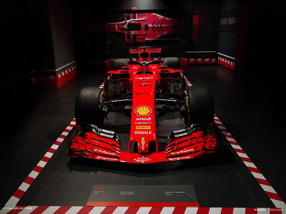 A 2018 Ferrari Formula 1 race car on display at the Ferrari Museum in Maranello, Italy.