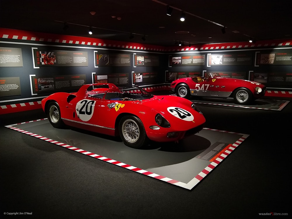 Vintage Ferrari race cars on display at the Ferrari Museum in Maranello, Italy.
