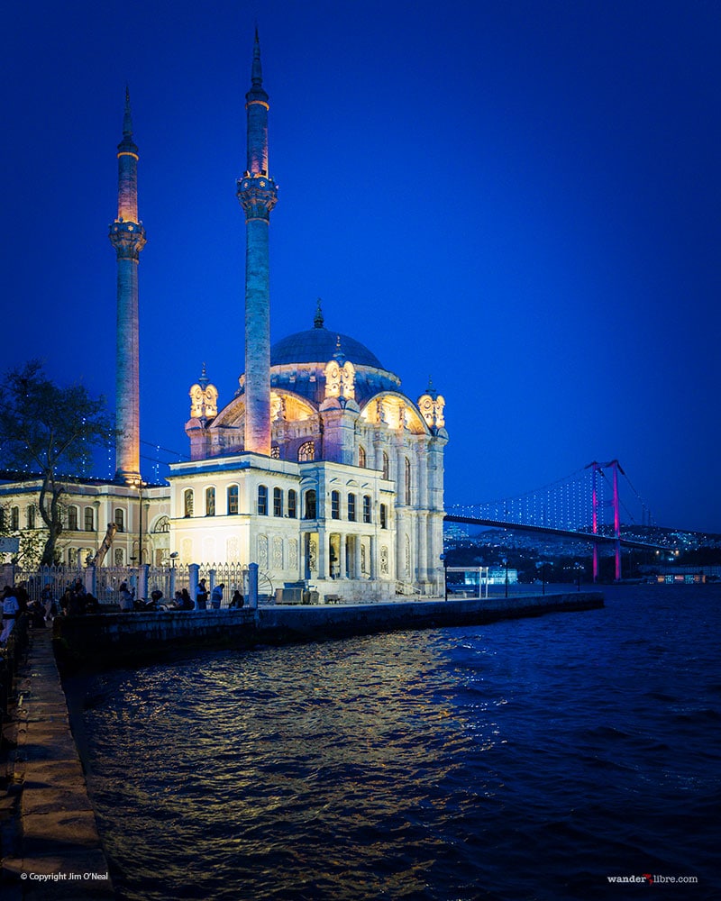 A night photo of Otakoy Mosque in Istanbul Turkey