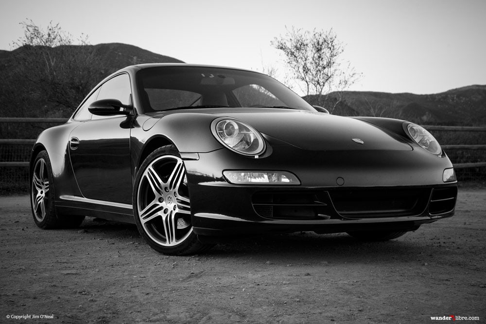 A portrait of a black Porsche 911 997 Carrera 4S.