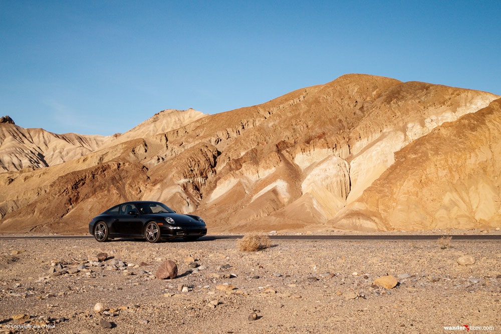 A photo of a Porsche 911 in Death Valley, CA while on the ultimate road trip across California.