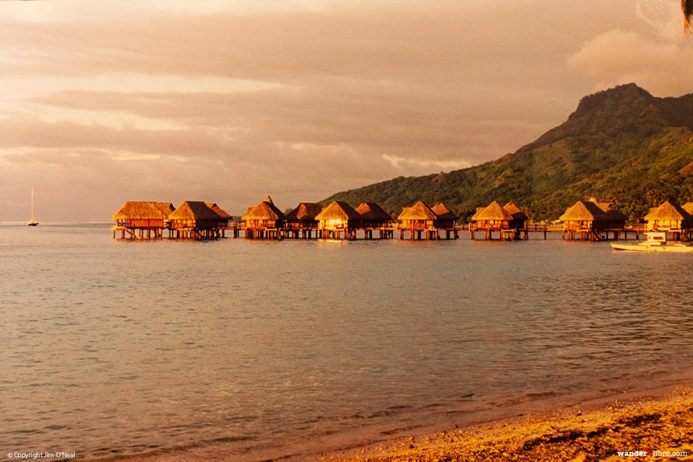 A sunset photo of our overwater bunglow in Moorea, French Polynesia.